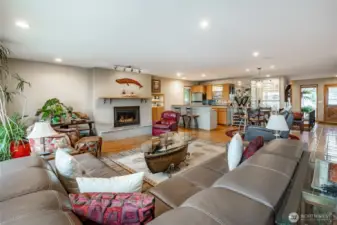 Great room has classic Oak Hardwood floors, incredible views, multi speed natural gas fireplace and bar area