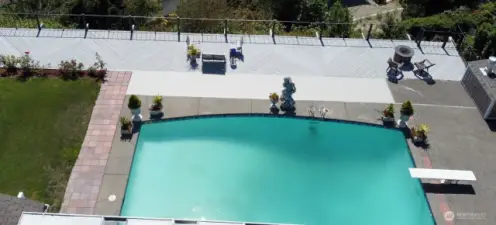 Host a dream party with your in-ground pool, grass lawn, expansive deck, and covered patio