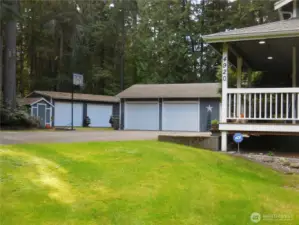 Large area asphalted Parking Pad for the 1800 plus Sq Foot of Detached Garages & Shops!! Woo Hoo-honey I am going to the Shop.. Which One she asks??