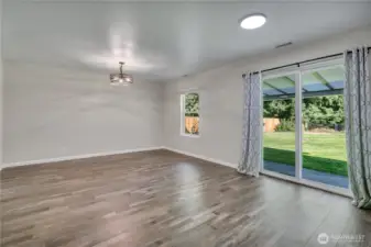 Step from the dining area right onto the covered back patio—perfect for seamless indoor-outdoor living.