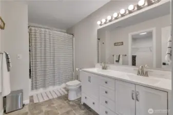Relax and refresh in the primary bath, complete with convenient access to your walk-in closet