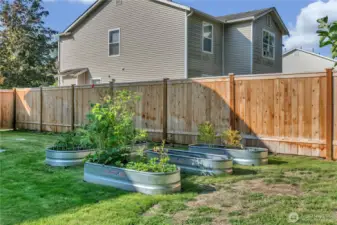 Gardening made easy with raised garden beds, ready for your favorite flowers or fresh produce.