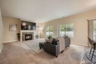 Expansive informal living will accommodate your comfiest sectional & recliners for that movie marathon on this professionally mounted, 80"(?) TV