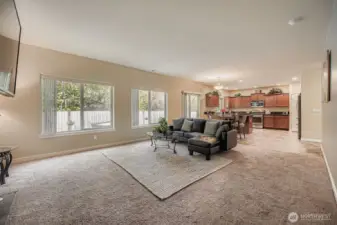 This wall of windows overlooks your tree lined backyard buffer. Exit through the slider to take in all the colorful trees and sounds of birds