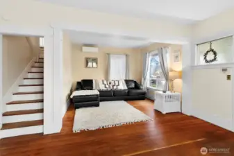 Light-filled living room with original fir floors