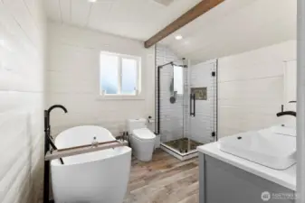 Fully remodeled bathroom with statement freestanding tub