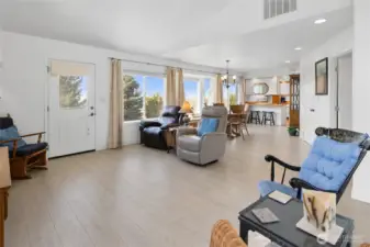 View from living room looking back towards dining room, access to back porch and back yard area.