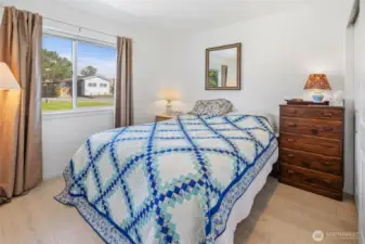 3rd bedroom looking out at ADU and front yard.