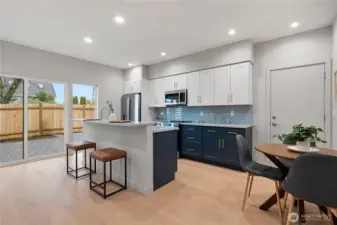 Full size kitchen with plenty of storage, quartz countertops, and stainless steel appliances.