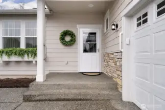 Front entry with covered porch. Customized and upgraded Landed Gentry home.
