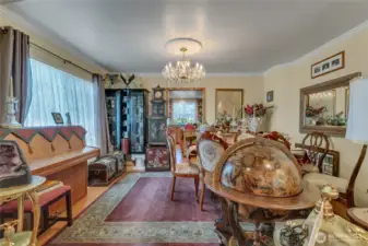 Elegant dining space highlighted by a sparkling crystal chandelier.