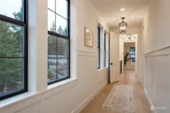 Extra wide hallways with access to Guest, Bonus, Primary and Laundry areas.