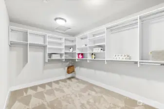 Large primary walk-in closet with built-ins to keep you organized.