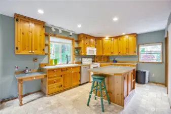 The fabulous country kitchen is so big and comes complete with solid-wood knotty pine cabinets.
