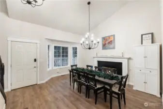 Large dining room with two story ceilings as you enter and wood burning fireplace. (Could be a living room)