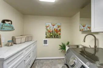 Cabinetry above the Washer & Dryer plus nice sized Cabinet to fold clothes.