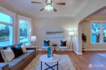 Spacious Living Room With Ceiling Light and Fan