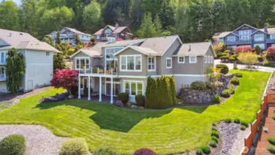 The surrounding greenspace enhances the curb appeal of this gorgeous home.