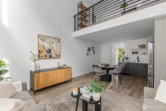 Soaring ceilings and a mezzanine-level overlook define this light-filled, open-concept main floor.