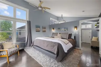 Vaulted ceiling in the spacious primary bedroom.  Huge windows, updated flooring.