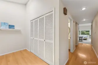 The front entry with geaming hardwood floors and a generous coat closet.