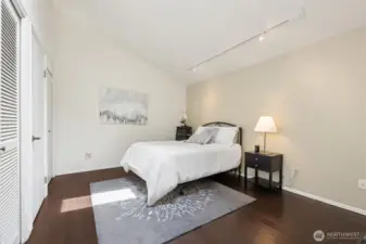 Track lighting and a skylight brighten this room. Throuoghout this home you wil love the gallery walls beckoning your art displays.