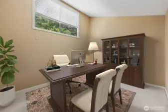 The virtual staging shows a welcoming home office.