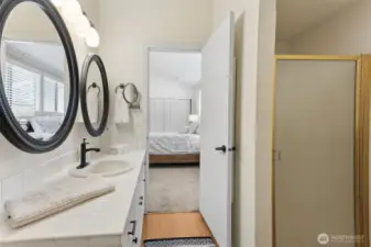 You are ins the bathroom with the shower stall to the right.
