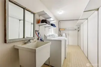 The laundry room is located inside the same door that leads to the double garage.