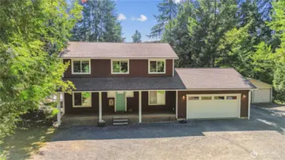 10 year young home on a shy acre with shop and RV parking