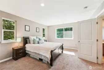Primary suite overlooks expansive back yard