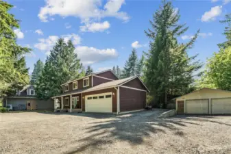 RV parking between house and detached garage/shop
