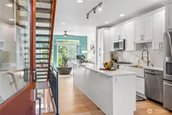 From the front door you get a great view of the updated kitchen, the beautiful new engineered hardwood floors, the striking floating staircase and the overall connectivity between floors.