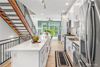 This island is striking - and massive! And look at all that cabinet space! There's even a pantry cabinet with pullout drawers!