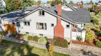 This charming home is located on a corner lot, the building opposite the left of the fence is a BIG SHOP!