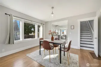The dining room can accommodate a much larger dining set. The big windows really brighten up the room.