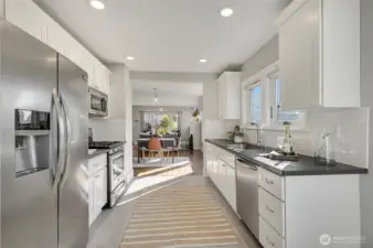 The kitchen view to dining and living room. The kitchen is perfectly laid out.
