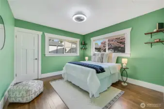 The bright and spacious primary suite. You have to love the corner windows.