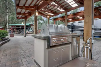 BBQ HOOKED TO IN GROUND PROPANE TANK