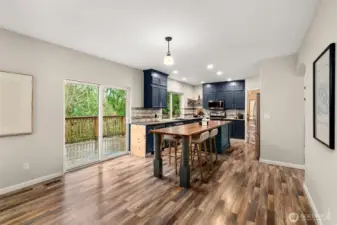 The custom kitchen island is not to be missed! Great for hosting, food prep, and a gathering table to share a meal.