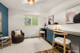 The home office has built in desks ready to tackle any project.