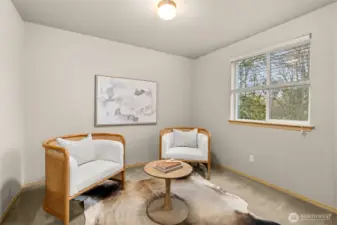 Connected to the primary suite is an additional sitting room that is the perfect area to relax in your own space.