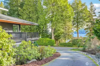 Peek-a-boo water views are evident from most of the rooms throughout the house. New paint, updated landscape, and a huge remodel inside and just the start of the updates in the stunning home.