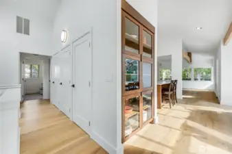 New built-n curio cabinet with walnut wood and class doors showcase your collections or dishware. new engineered floors, re-stained wood beams, new entryway skylight, new trim and base throughtout are a few of the new features in this home.