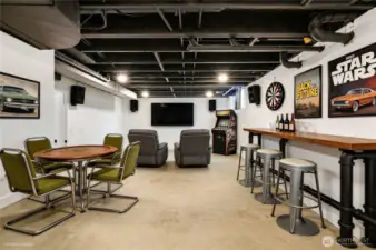 Once an unused room, the sellers have painted the ceiling and turned this furnace room into a game room. This virtual staging shows one way you can use this flex room, and it's fun!