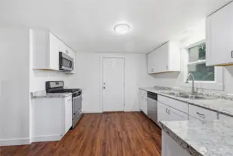 Large ktichen with stainless steel appliances