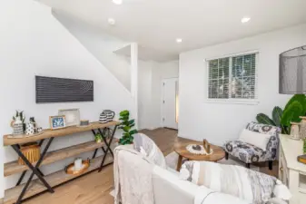 Gracious entry way and living room area. **staged unit B**