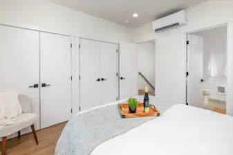 Primary bedroom on second level with a whole wall of closet space. **staged unit B**