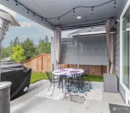 Covered patio with smart lighting and privacy screen