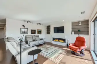 The generous livingroom includes built-ins and a new linear fireplace.